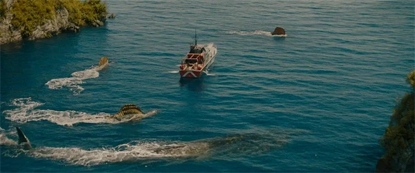 A boat surrounded by dinosaurs in the water in "Jurassic World: Rebirth".