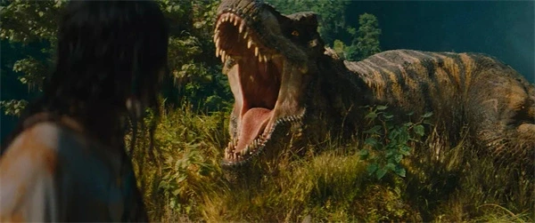A person facing a roaring T - Rex in "Jurassic World: Rebirth".