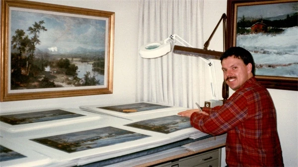 A man works with paintings in a studio in "Art For Everybody".