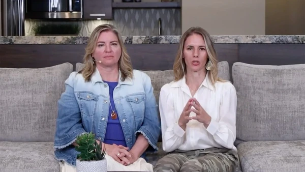 Two women sit on a couch in the docuseries Devil in the Family: The Fall of Ruby Franke.