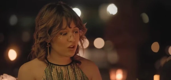 A woman talks in a dimly lit setting in "Love on the Spectrum U.S".